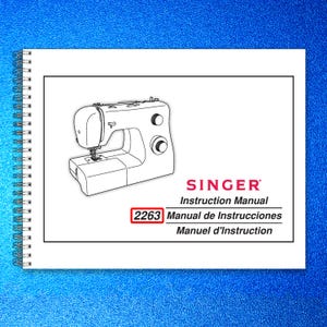 May include: A Singer instruction manual with a spiral binding. The cover features a black and white illustration of a sewing machine. The text "SINGER Instruction Manual" is displayed, along with "2263 Manual de Instrucciones Manuel d'Instruction."