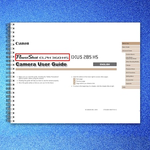 May include: A Canon PowerShot ELPH 360 HS Camera User Guide. The spiral-bound manual has the Canon logo at the top, with the camera model name in red. The guide is in English and includes safety precautions and instructions.