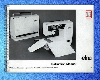 May include: A spiral-bound instruction manual for an Elna TX electronic sewing machine. The cover features a black and white photograph of the sewing machine and its carrying case, with the text "Instruction Manual" and "This machine corresponds to the EEC-prescriptions 76/889".