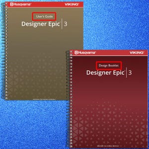 May include: Two spiral-bound manuals titled Husqvarna Viking Designer Epic 3. The top manual is brown with the text User's Guide, and the bottom manual is dark red with the text Design Booklet. Both feature a geometric triangle pattern at the base.