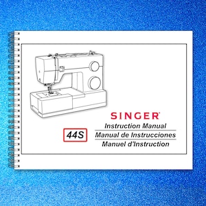 May include: A Singer Instruction Manual for the 44S model sewing machine. The cover features a line drawing of the machine, with the Singer logo and text in English, Spanish, and French. The manual is spiral-bound.