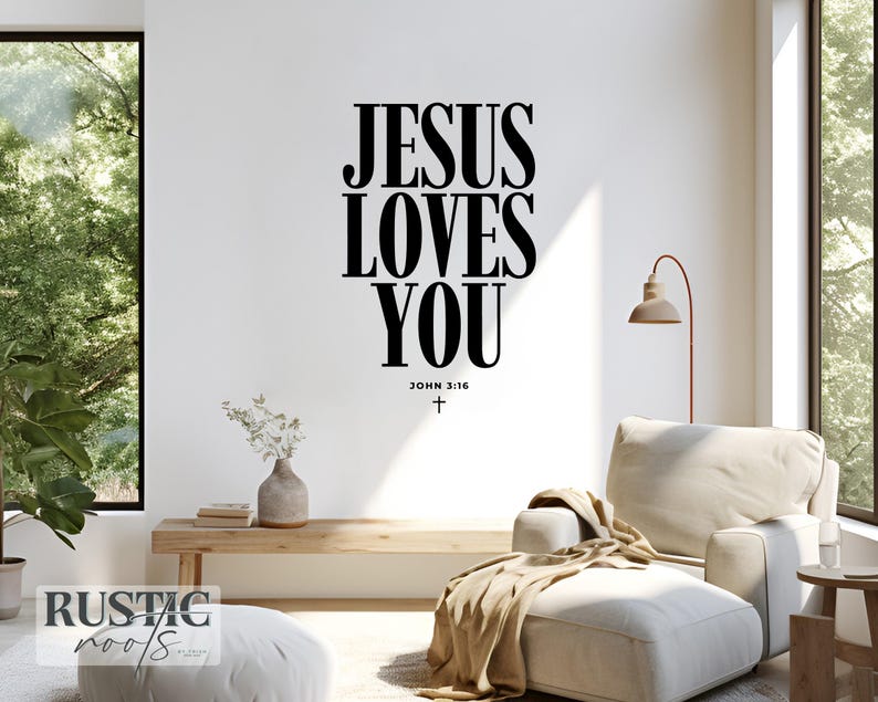 May include: A living room scene with a white wall featuring the text "JESUS LOVES YOU" in large black letters. Below the text is "JOHN 3:16" and a cross. The room includes a beige armchair, ottoman, and wooden bench.