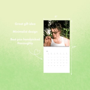 May include: A calendar featuring a photograph of a person wearing sunglasses and a white tank top, with a July calendar page. The calendar is 8 inches wide and 17 inches tall. Text on the image includes "Great gift idea", "Minimalist design", and "Best pics handpicked thoroughly."