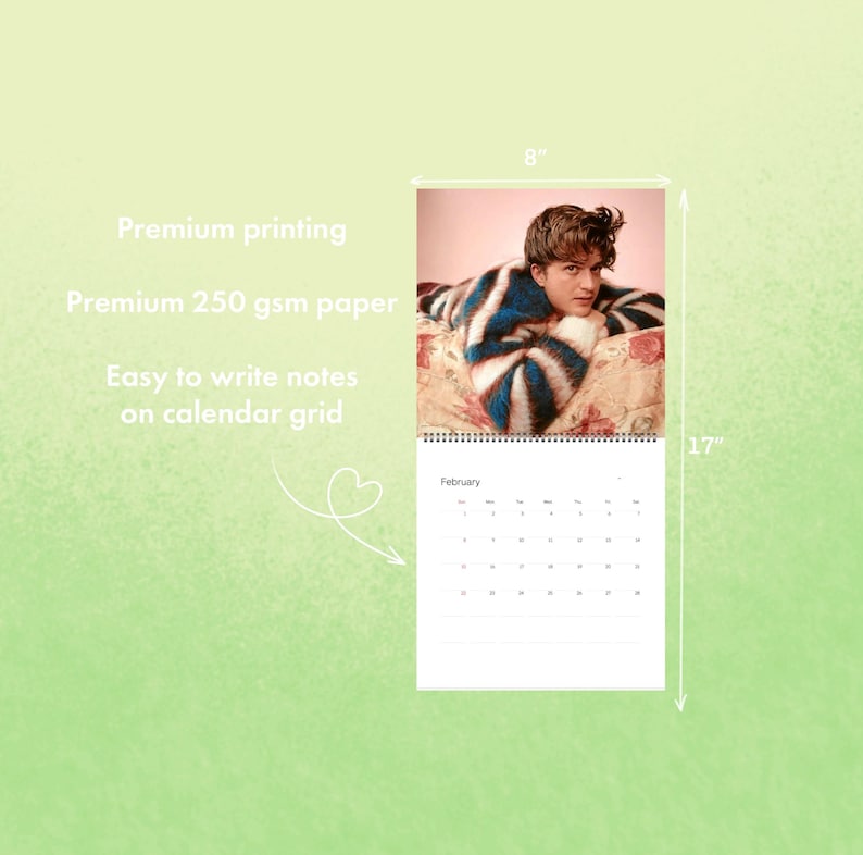 May include: A wall calendar featuring a person wearing a blue and white striped sweater. The calendar is 8 inches wide and 17 inches tall. The text on the calendar reads "February". The calendar is printed on premium 250 gsm paper.