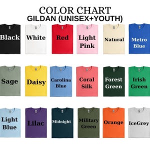 May include: A Gildan colour chart for unisex and youth t-shirts featuring eighteen colour swatches labelled Black, White, Red, Light Pink, Natural, Metro Blue, Sage, Daisy, Carolina Blue, Coral Silk, Forest Green, Irish Green, Light Blue, Lilac, Midnight, Military Green, Orange, and IceGrey.