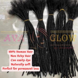 May include: Bundles of black dreadlocks tied with rubber bands. The image includes text that reads "100% Human Hair, Non Itchy Hair, Can easily dye, Naturally soft, Perfect for permanent locs."