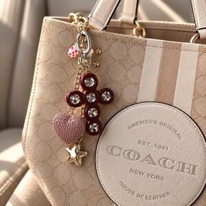 Luxury Crystal Bag Charm, Cross Purse Charm & Statement Keychain – La Parure by Mainline