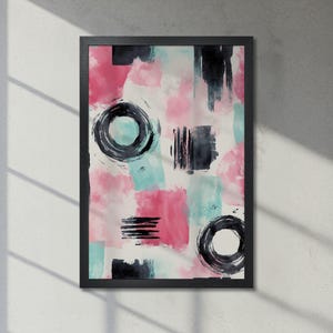 Arte minimalista moderno: póster abstracto enmarcado con colores vibrantes, rosa y verde azulado, con estampados circulares negros. Envío rápido.