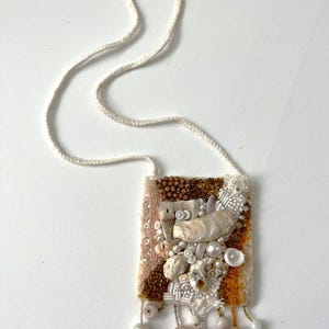 Colorful Felted wool necklace decorated with embroidery and beads