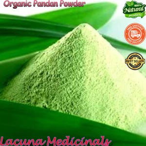 May include: A pile of finely ground, light green organic pandan powder, with the text "Organic Pandan Powder" at the top. The powder sits on a bed of green leaves, with the text "Lacuna Medicinals" at the bottom. There are also product labels.