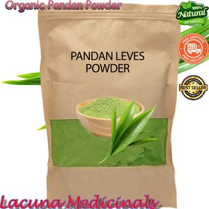 May include: A brown paper bag of organic pandan powder. The bag has the words "Pandan Leves Powder" printed on it. A wooden bowl filled with green powder and pandan leaves are in front of the bag. The words "Organic Pandan Powder" are at the top.