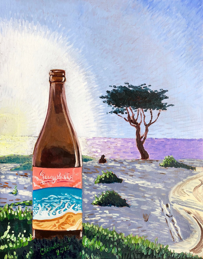 May include: A brown glass bottle with a pink and blue label that says "Seaybelle" on a beach scene with a lone tree and a distant figure. The sky is a light blue with a white sun.