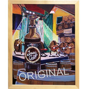 May include: A painting of a brown bottle with the words "Java Cask" on the label. The bottle is surrounded by barrels and three cartoon-like figures playing musical instruments. The painting is framed in wood.