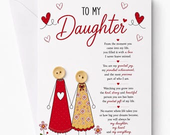 May include: A greeting card with a white envelope featuring the text TO MY Daughter and a poem. The illustration shows two figures with button heads, one in a red dress with a white heart and one in a yellow floral dress, standing among small flowers.