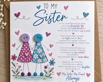 May include: A square greeting card with the text TO MY Sister and a poem. Two figures made of buttons and ink drawings stand in a field of flowers. One figure wears a purple polka dot dress, the other a blue daisy print dress. Hearts surround them.