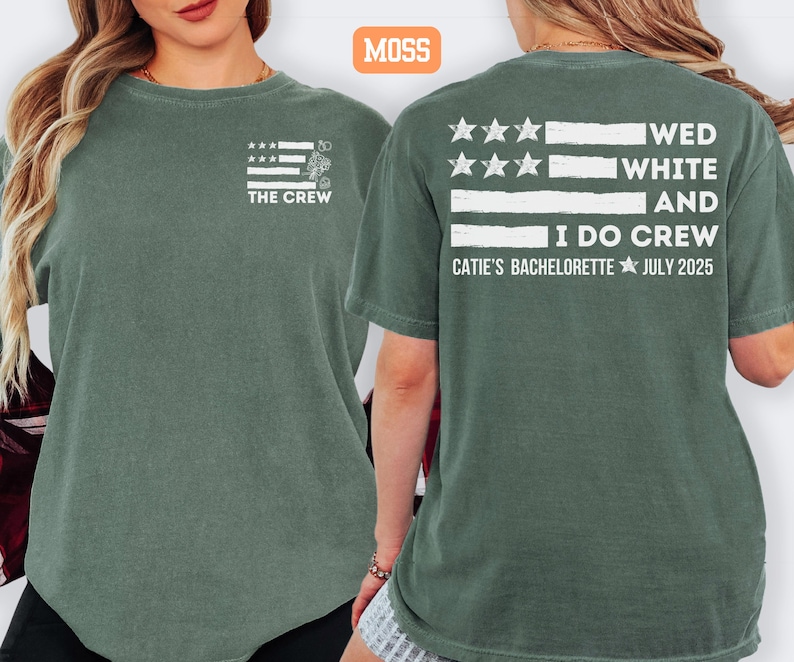May include: Moss green t-shirts with white text and graphics. The front of the shirt says "THE CREW" with a flag design. The back of the shirt says "WED WHITE AND I DO CREW CATIE'S BACHELORETTE JULY 2025" with a flag design.