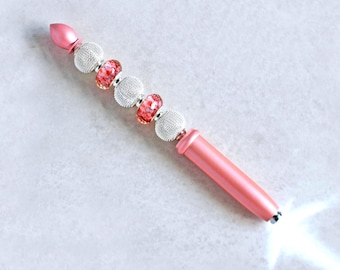 Mini linterna rosa para bolso o mochila