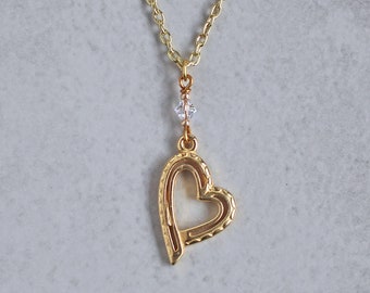 Pendentif coeur doré sur le côté