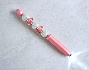 Mini linterna rosa para bolso o mochila