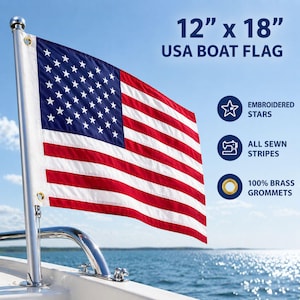 May include: A 12" x 18" USA boat flag with embroidered stars, all sewn stripes, and 100% brass grommets. The flag features a blue field with white stars and red and white stripes, mounted on a boat.