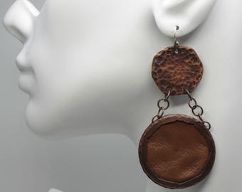 Ready to ship. Copper and brown leather artisan distress hammered oxidized rustic dangle earrings. Two circles on chain. All links soldered.