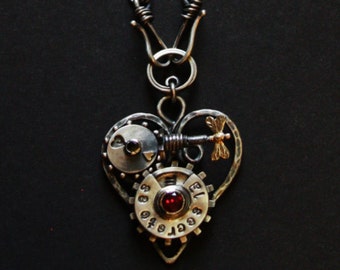 Kinetic necklace "Enigma". Heart shaped. Interactive with a spin.