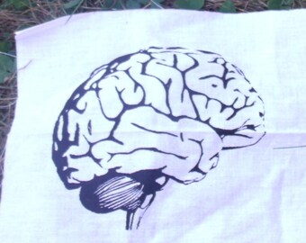 May include: A white fabric patch with a black and white illustration of a human brain.