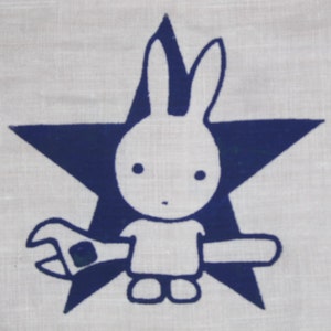 May include: A white bunny with a wrench in its hand, standing in front of a blue star.