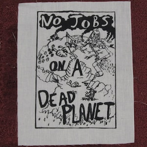 May include: Black and white illustration of a desolate landscape with the text "No Jobs On A Dead Planet".