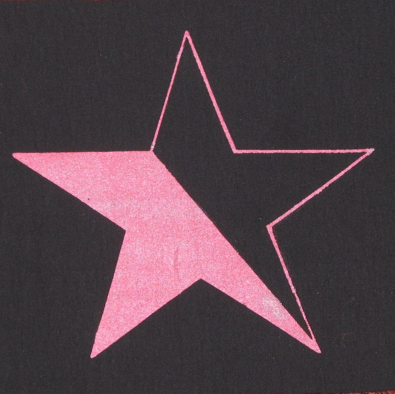 May include: A pink five-pointed star on a black background.