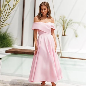 Off shoulder pink midi dress for women in premium diagonal crepe with romantic flared silhouette perfect for weddings or summer events