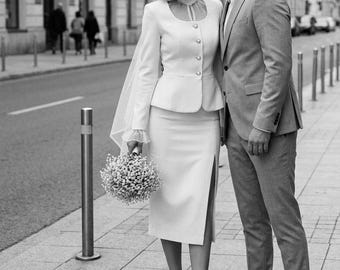 White bridal tweed skirt suit — structured peplum jacket and slit pencil skirt