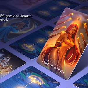 May include: A tarot card titled Eight of Wands featuring a figure with long red hair in a golden dress surrounded by floating wands. The card is made of high end 350 gsm anti-scratch matte cardstock and is displayed among other tarot cards.