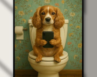 May include: A framed digital print featuring a Cavalier King Charles Spaniel sitting on a toilet, holding a smartphone. The dog has brown and white fur. The background has a floral wallpaper design. The text "Digital Download" is at the bottom.