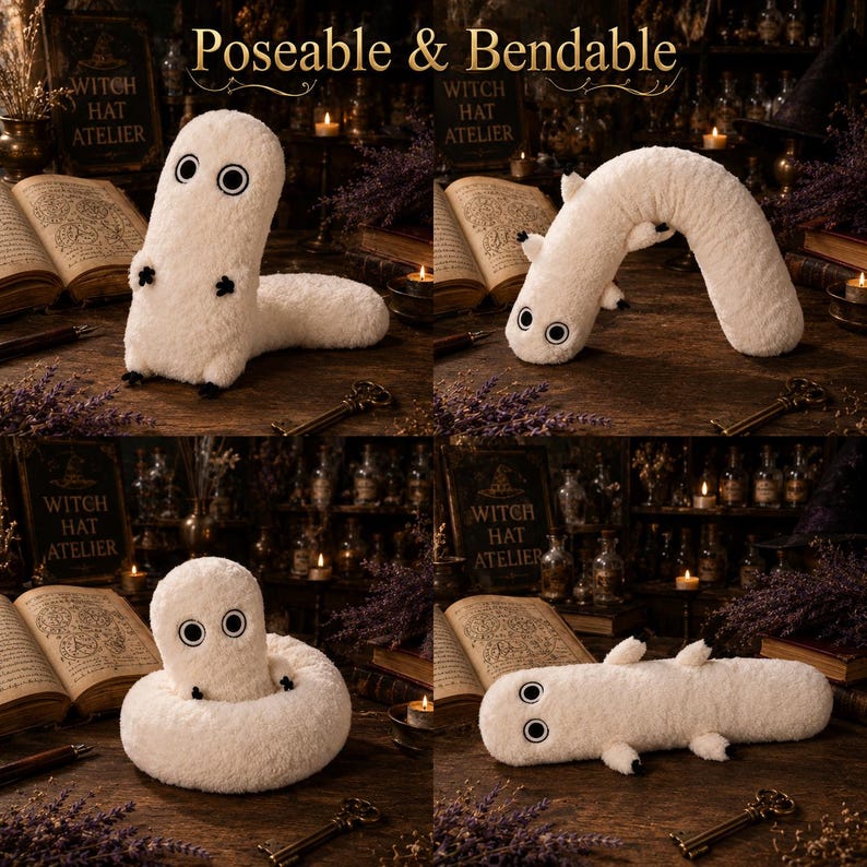 May include: A poseable and bendable off-white plush creature with a long, cylindrical body, two large circular black and white eyes, and four small black-tipped limbs. The plush is shown in four different positions on a dark wooden surface.