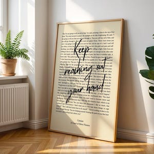 A Court of Silver Flames Print: Nesta & Cassian Quote (Digital Download) Chapter 50 Quote
A framed art print with a cream-colored background. The print features a quote in black cursive that reads 'Keep reaching out your hand.' The text is layered over a smaller font of a novel. The bottom of the print reads 'Cassian, A Court of Silver Flames.'