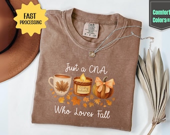 Comfort Colors® Just a CNA Who Loves Fall Shirt, Cozy Autumn CNA Tee, Pumpkin Coffee Candle Fall Shirt, Fall Nursing Assistant Gift