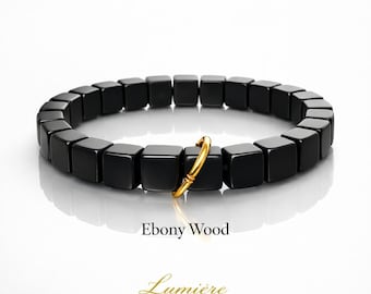 Ebenholz Holz Armband mit Gold Twist, Minimalistisches spirituelles Amulett, schwarze natürliche Holzperle