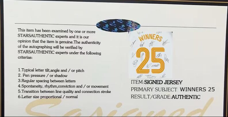 May include: A certificate of authenticity with text that reads "WINNERS 25" on a jersey. The item is a signed jersey, with the primary subject being "WINNERS 25". The result/grade is "AUTHENTIC".