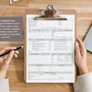 May include: A clipboard with a printed caregiver log, featuring sections for tracking medications, meals, and mood. The log includes space for notes and a supply checklist. A pencil rests on the wooden surface.