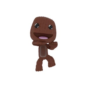May include: A brown, stylized character with a smiling face, black eyes, and a pink mouth. The character has a rounded head and body, with outstretched arms and legs. The figure is standing against a white background.