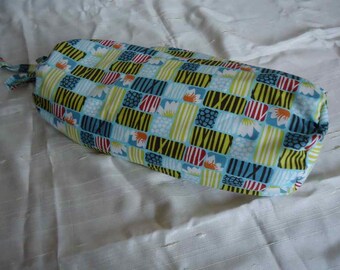 Neck/back roll with a removable cover out of a beautiful cotton  fabric