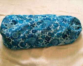 Neck/back roll with removable cover, with blue funky floral cover.