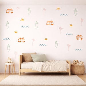 May include: A collection of wall decals featuring orange camper vans with surfboards on top, green surfboards, pink palm trees, yellow suns, and blue wave lines arranged on a white wall above a wooden bed frame with neutral bedding.