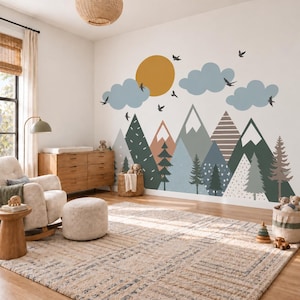 May include: A wall mural featuring a mountain landscape with a large mustard yellow sun, light blue clouds, and black birds. The mountains are depicted in various shades of green, blue, and brown with patterns including stripes and dots.