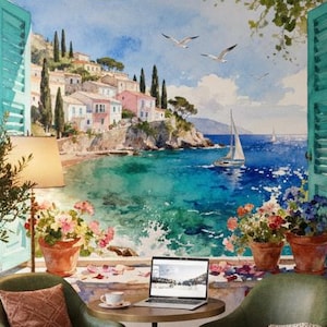 May include: A cafe interior with a large painting of a coastal scene. The painting shows a vibrant seascape with a sailboat and colorful buildings. The room features green chairs, a small table with a laptop, and a brick wall.
