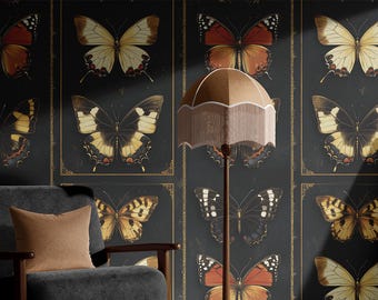 May include: A room featuring a dark gray armchair with a brown pillow, a floor lamp with a fringed shade, and a wall covered in framed butterfly prints in shades of brown, yellow, and black. A framed artwork is visible on the right.