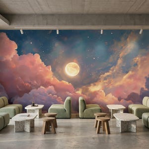 May include: A modern interior featuring a mural of a night sky with a full moon and clouds in shades of pink, orange, and blue. The room includes green sofas, small tables, and wooden stools, creating a serene and inviting atmosphere.