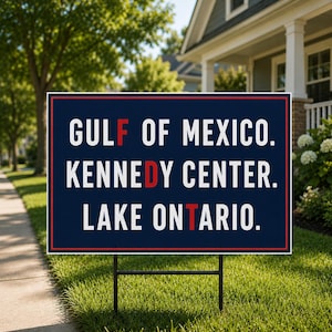 May include: A rectangular yard sign with a dark blue background and a thin red border. The text reads GULF OF MEXICO, KENNEDY CENTER, and LAKE ONTARIO in white capital letters, with the letters F, D, and T highlighted in red.