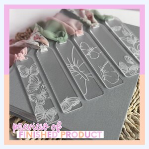 Clear acrylic bookmarks with white butterfly designs and pink ribbons. The bookmarks are arranged on a gray surface, with the text "preview of FINISHED PRODUCT" at the bottom. The bookmarks are a unique gift idea.
Laser Cut Bookmark SVG File Digital Craft Pattern Acrylic Cutting Design Butterfly Elements Nature Inspired Gift Making File Glowforge XTool CO2 Compatible Instant Download Ready Bridesmaid Mothers Day Grandma Present Idea
